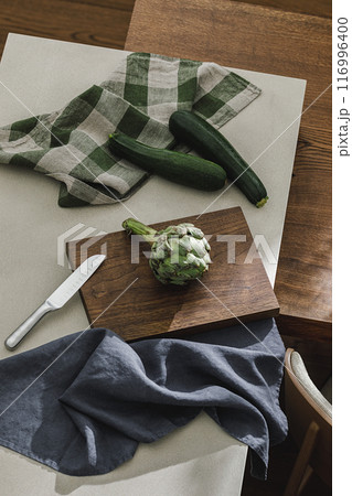 Assortment of fresh vegetables, linen towels and stainless still kitchen appliances. Healthy food cooking ingredients background with fresh vegetables Assortment of fresh vegetables, linen towels and stainless still kitchen appliances. Healthy food cooking ingredients background with fresh vegetables 116996400
