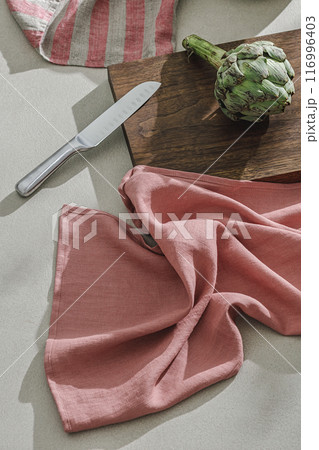 Fresh artichoke, linen textile. Healthy food cooking ingredients background with fresh vegetables 116996403