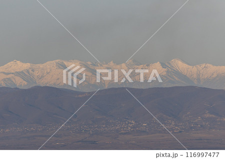 Majestic Snow-Capped Peaks of the Georgian Mountain Range 116997477