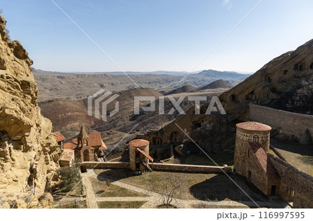 Majestic Castle Perched Among Mountain Peaks Majestic Castle Perched Among Mountain Peaks 116997595