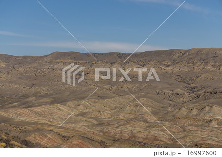 Majestic Mountain Range Embraced by Heavenly Blue Sky 116997600