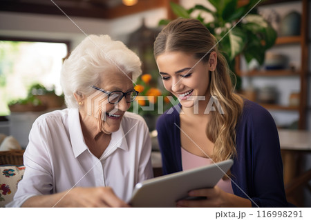 Tech Laughter Bonding Moments as an Adult Daughter Guides Her Elderly Mother in Tablet Use. created with Generative AI 116998291