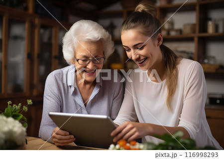 Tech Laughter Bonding Moments as an Adult Daughter Guides Her Elderly Mother in Tablet Use. created with Generative AI 116998293
