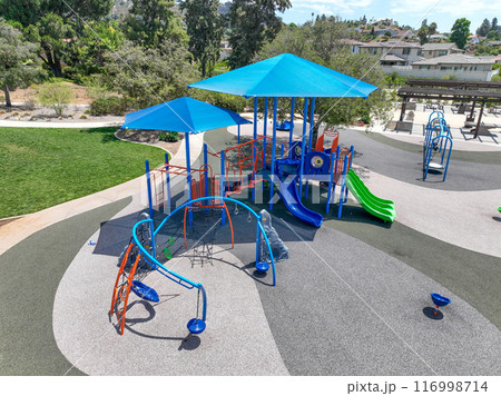 Colorful children playground activities in community public park  116998714