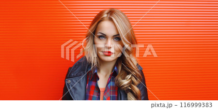 Portrait beautiful young blonde woman posing in black leather jacket on colorful background 116999383