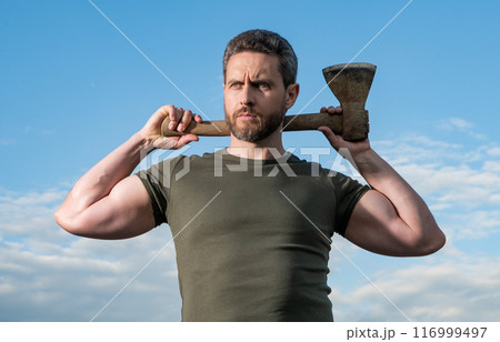 confident man with axe. woodman man hold ax. brutal man on sky background confident man with axe. woodman man hold ax. brutal man on sky background 116999497