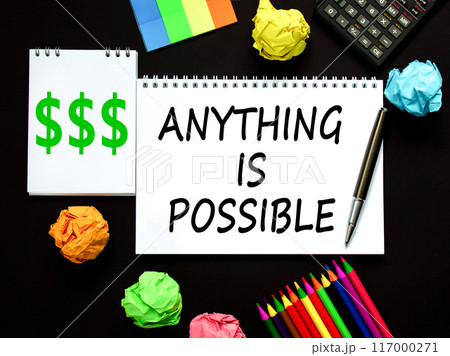 Anything is possible symbol. Concept words Anything is possible on beautiful white note. Beautiful black background. Black pen. Calculator. Business anything possible concept. Copy space. 117000271