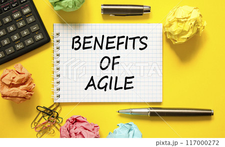 Benefits of agile symbol. Concept words Benefits of agile on beautiful white note. Beautiful yellow background. Black pen. Calculator. Colored paper. Business benefits of agile concept. Copy space. 117000272