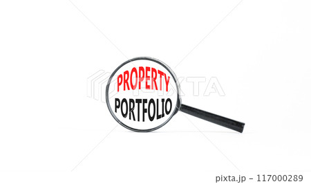 Property portfolio symbol. Concept words Property portfolio in beautiful magnifying glass. Beautiful white paper background. Business Property portfolio concept. Copy space. Property portfolio symbol. Concept words Property portfolio in beautiful magnifying glass. Beautiful white paper background. Business Property portfolio concept. Copy space. 117000289