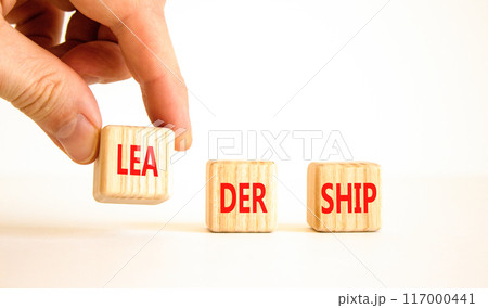 Leadership symbol. Concept word Leadership on beautiful wooden blocks. Businessman hand. Beautiful white background. Business leadership concept. Copy space. 117000441