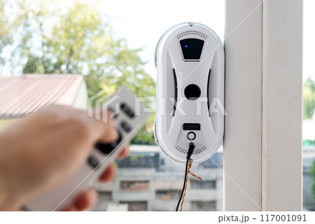 Remote control of a robotic window washer that washes glass from dirt and stains. 117001091