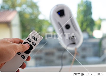 Remote control of a robotic window washer that washes glass from dirt and stains. 117001092