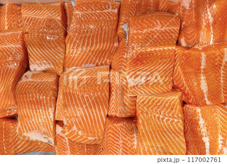 Top view of fresh raw salmon fillet displayed in wet market. Seafood concept Top view of fresh raw salmon fillet displayed in wet market. Seafood concept 117002761