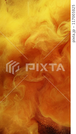 Smoke cloud. Sparkling particles. Ink water paint splash. Defocused whirl magical hypnotic orange red fluid art flaming mist background. 117003825