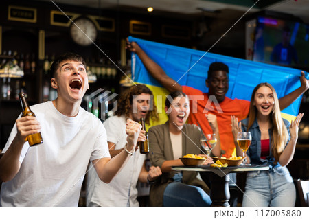 Ukraine football team fan spending time in bar 117005880