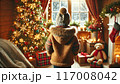 クリスマスの日に降雪を眺める子供の後ろ姿 117008042