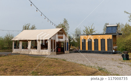 Sanitary module and reception in summer camp. Camping tent for outdoor summer holiday and vacation Sanitary module and reception in summer camp. Camping tent for outdoor summer holiday and vacation 117008735