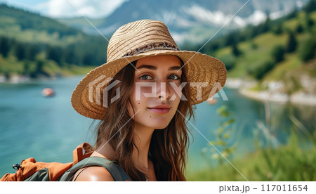 Portrait of young woman in summer hat. 117011654