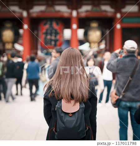 Tourist woman visit Sensoji Temple or Asakusa Kannon Temple is a Buddhist temple located in Asakusa, Tokyo Japan. Japanese sentence on red lantern means Thunder gate. 117011798