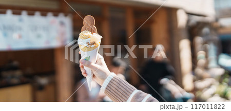 Woman showing Daibutsu or Buddha yogurt crepe, popular dessert in Kamakura, Kanakawa, Japan 117011822