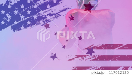 Image of caucasian american football player and flag of usa Image of caucasian american football player and flag of usa 117012120
