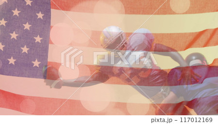 Image of caucasian american football player and flag of usa Image of caucasian american football player and flag of usa 117012169