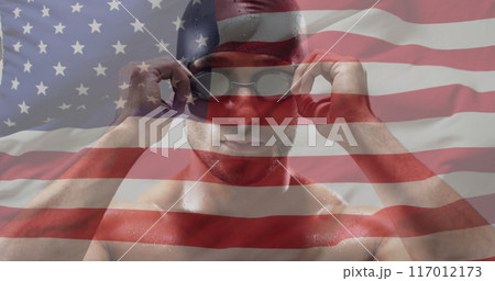 Image of flag of usa over biracial male swimmer 117012173