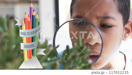Examining plant with magnifying glass, boy over back to school bargains image Examining plant with magnifying glass, boy over back to school bargains image 117012235