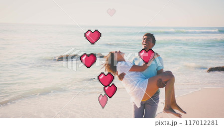 Image of hearts moving over biracial man carrying woman on beach in summer Image of hearts moving over biracial man carrying woman on beach in summer 117012281