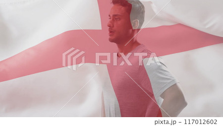 Image of flag of england over caucasian male athlete 117012602