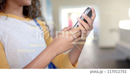 Image of digital data processing over biracial female student using smartphone in school 117012781