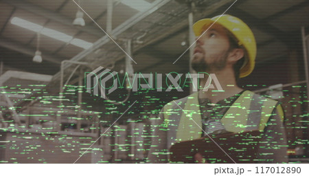 Worker in safety gear holding clipboard, DOWNLOAD text image over industrial background 117012890