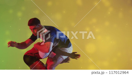 Image of glowing lights over male rugby players with ball Image of glowing lights over male rugby players with ball 117012964