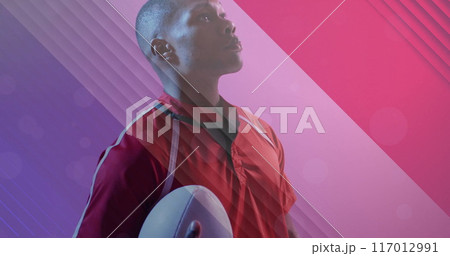 Image of flag of france over african american male rugby player with ball Image of flag of france over african american male rugby player with ball 117012991