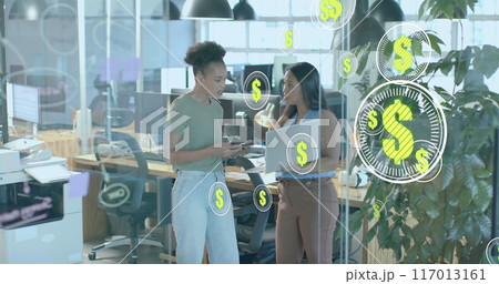 Image of dollar signs and data processing over diverse businesswomen in office Image of dollar signs and data processing over diverse businesswomen in office 117013161