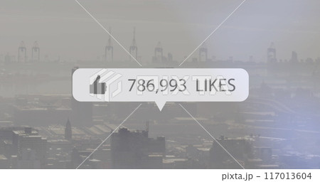 Image of social media like notification over modern cityscape 117013604