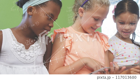 Image of math formulas over diverse pupils learning at school 117013680