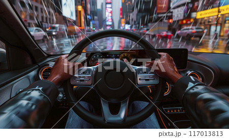 Driving in night scenery, hands on steering wheel. 117013813
