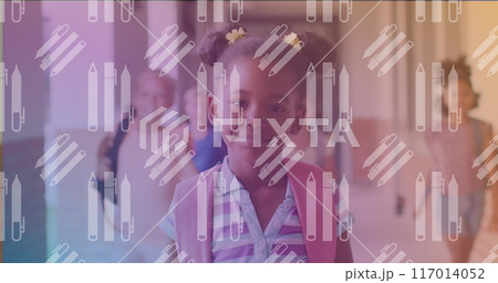 Image of pencils floating over happy african american girl Image of pencils floating over happy african american girl 117014052