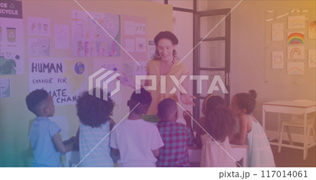 Image of pencils floating over happy african american girl 117014061