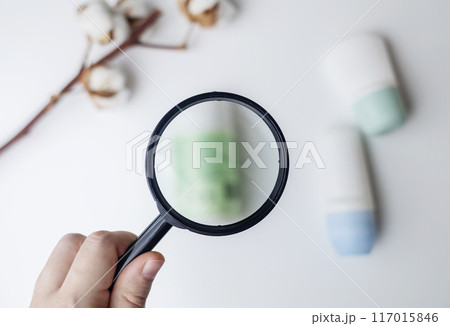 Choice of deodorant or antiperspirant. Looking at the jars on the table. Safe or critical deodorant ingredients Choice of deodorant or antiperspirant. Looking at the jars on the table. Safe or critical deodorant ingredients 117015846