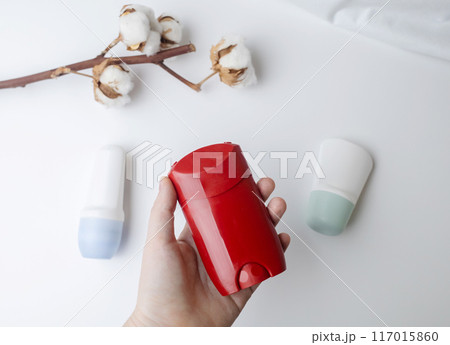 Choice of deodorant or antiperspirant. Looking at the jars on the table. Safe or critical deodorant ingredients 117015860