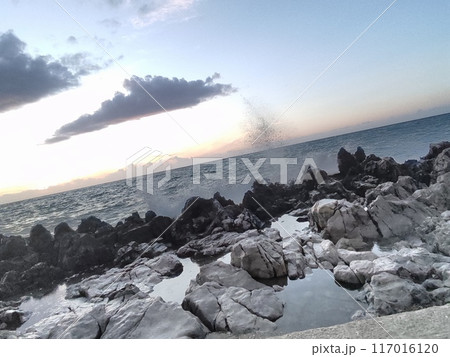 Golden hour at Cefalu, on the northern coast of Sicily, Italy. Sunset above the Tyrrhenian Sea 117016120