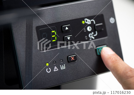 The man using the laser printer. 117016230