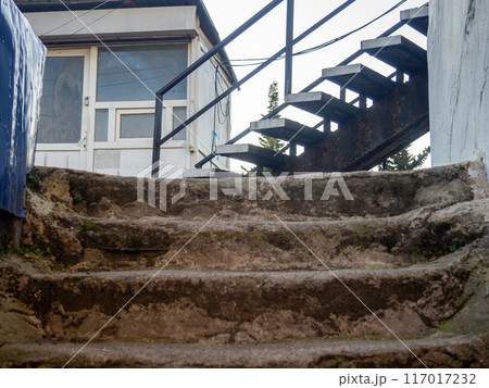 Stairs in a concrete structure. Labyrinths with stairs. Old architecture. Powerful structure. 117017232