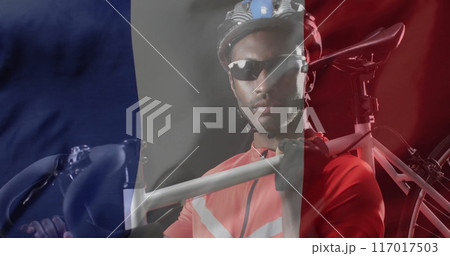 Image of flag of france over african american male cyclist Image of flag of france over african american male cyclist 117017503