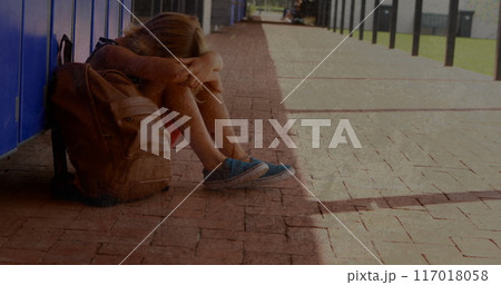 Image of moving background over sad caucasian schoolboy at school 117018058