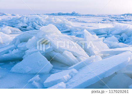 Winter landscape photo with ice hummocks and snow 117020261