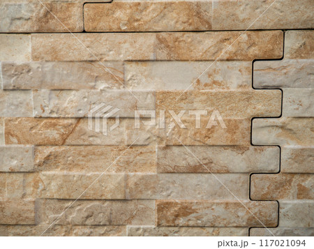 Wall of the house. Wall surface. Beige masonry. Smooth tile. Wall of the house. Wall surface. Beige masonry. Smooth tile. 117021094