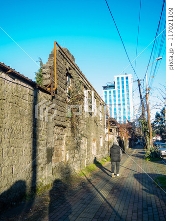 Window in a destroyed building. Remained a wall from the house. The concept of demolition of dilapidated housing. 117021109